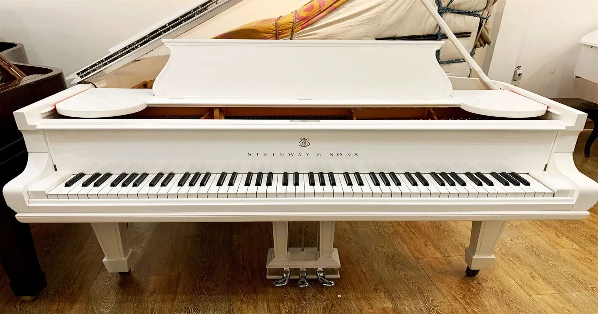white baby grand piano